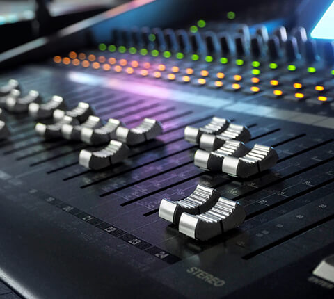 Close up of audio mixing board